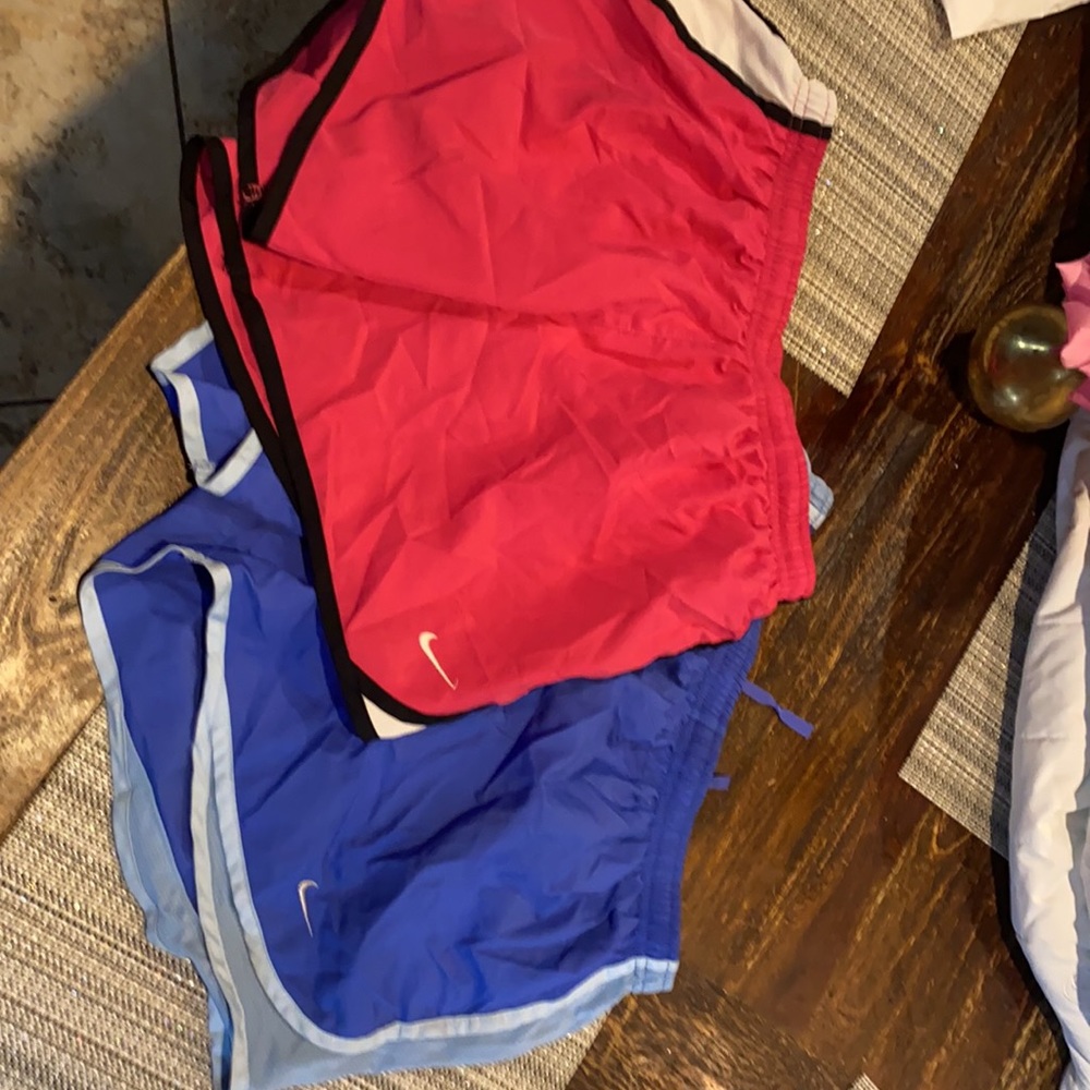 Two pair of Nike athletic shorts and one Reebok athletic shorts volleyball fit